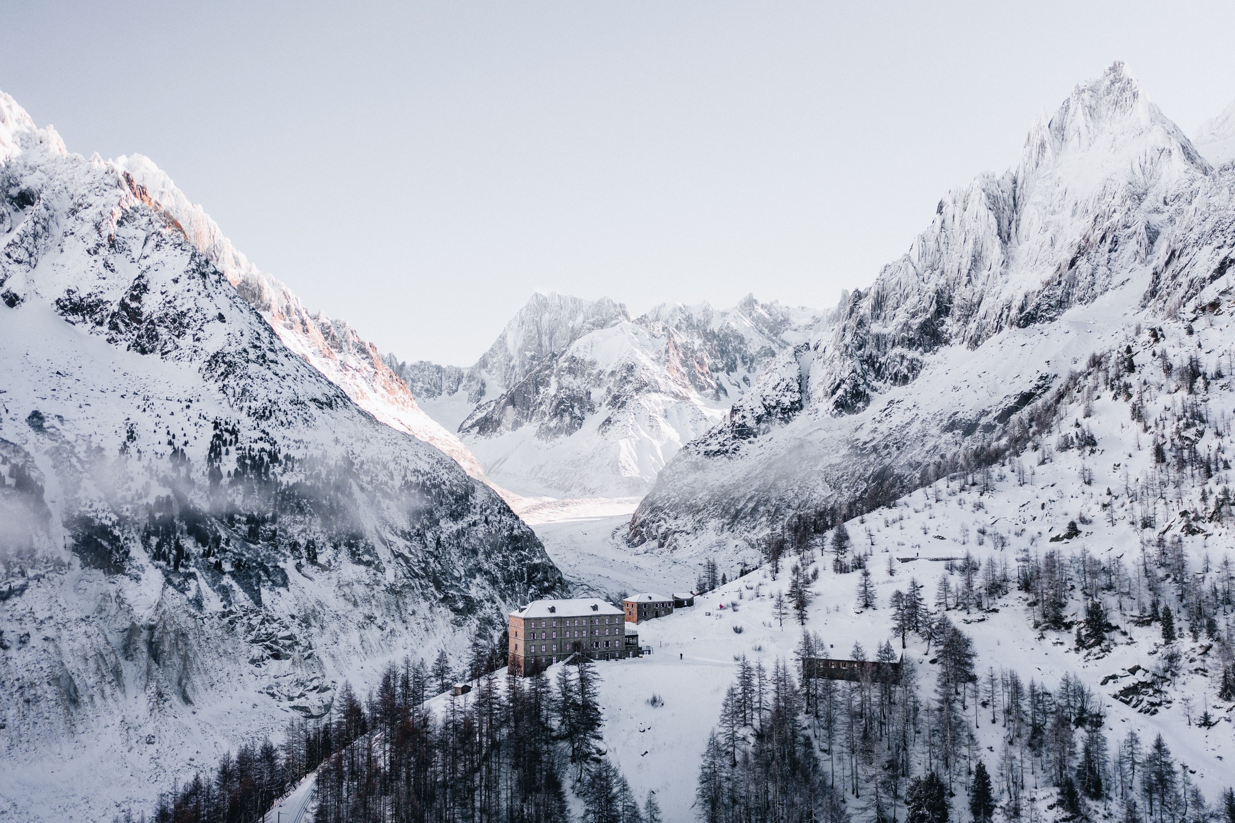 The Refuge du Montenvers in a vast landscape of snowy mountains