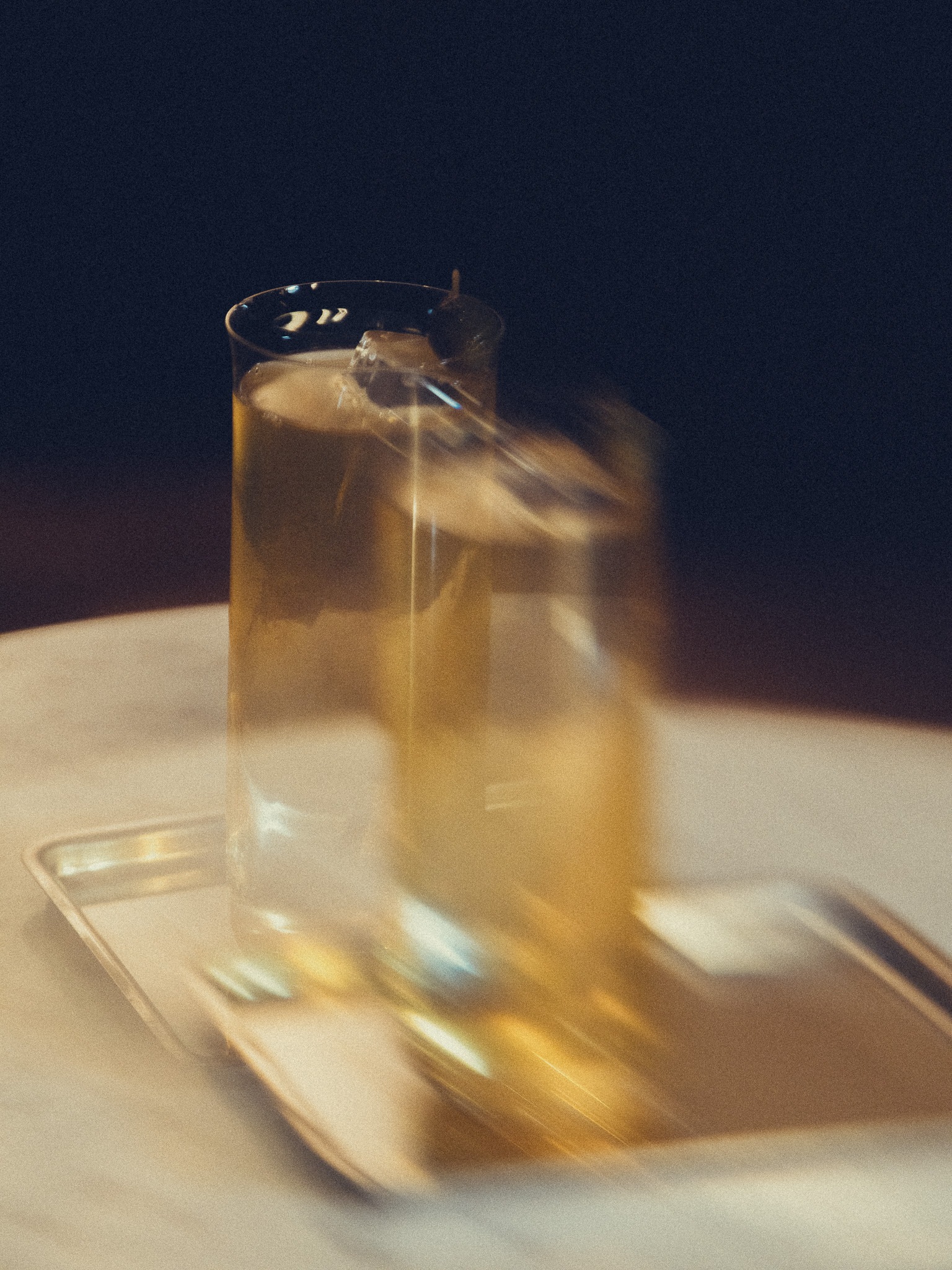 One of Romain’s cocktails, in shadow and reflected light.